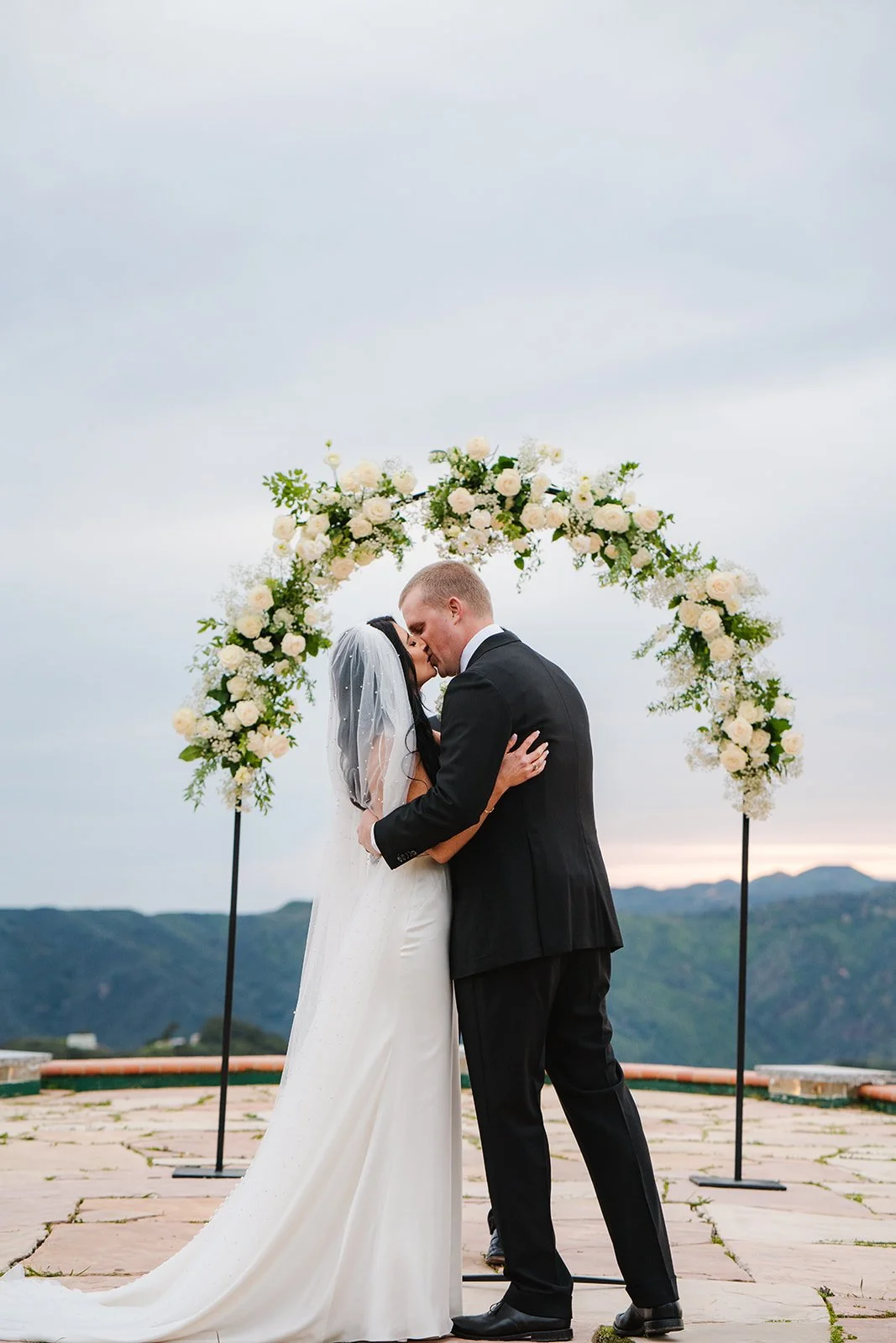 Wedding arch with bride and groom