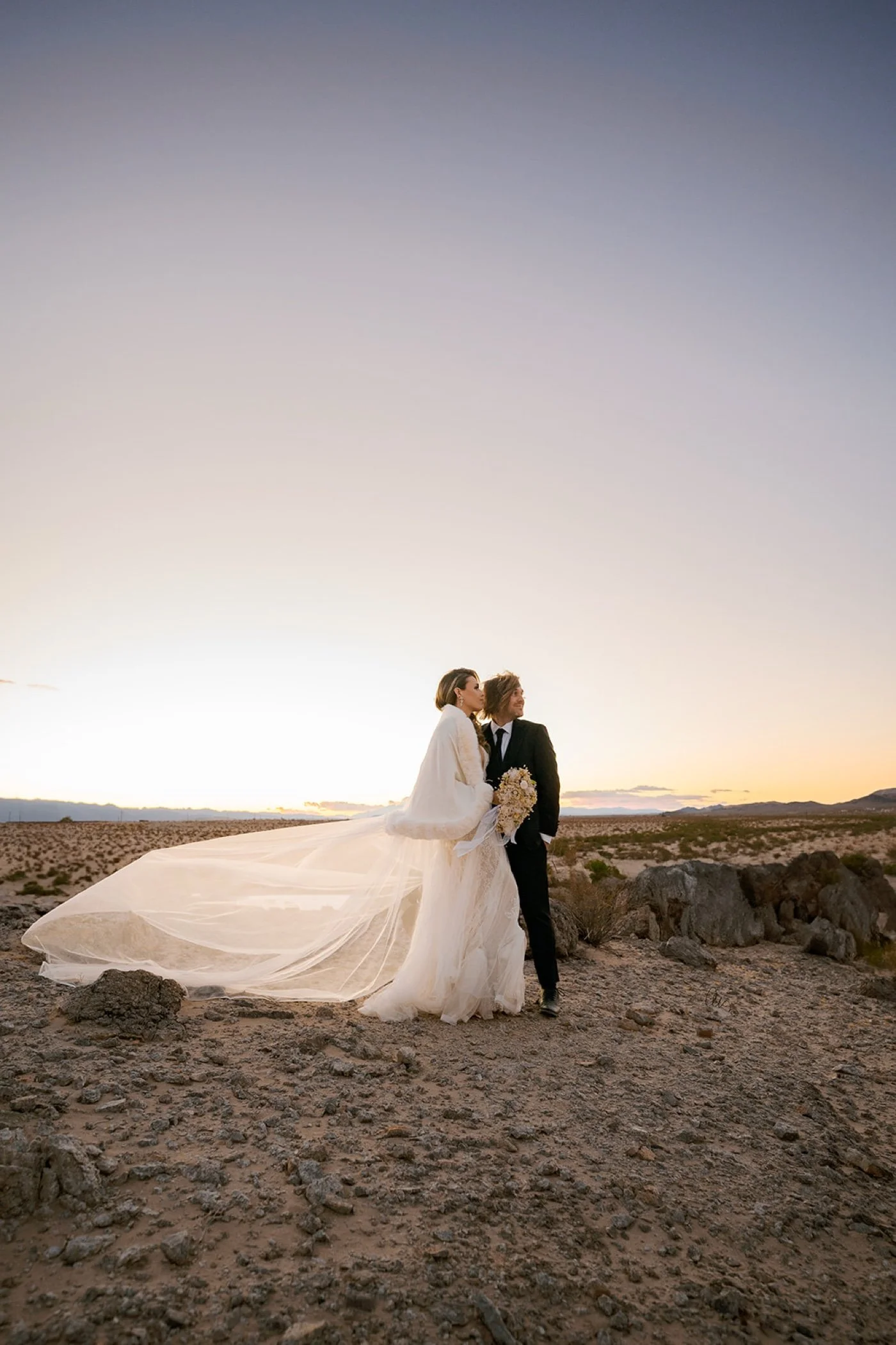 Bride and groom wedding portrait with wide sky