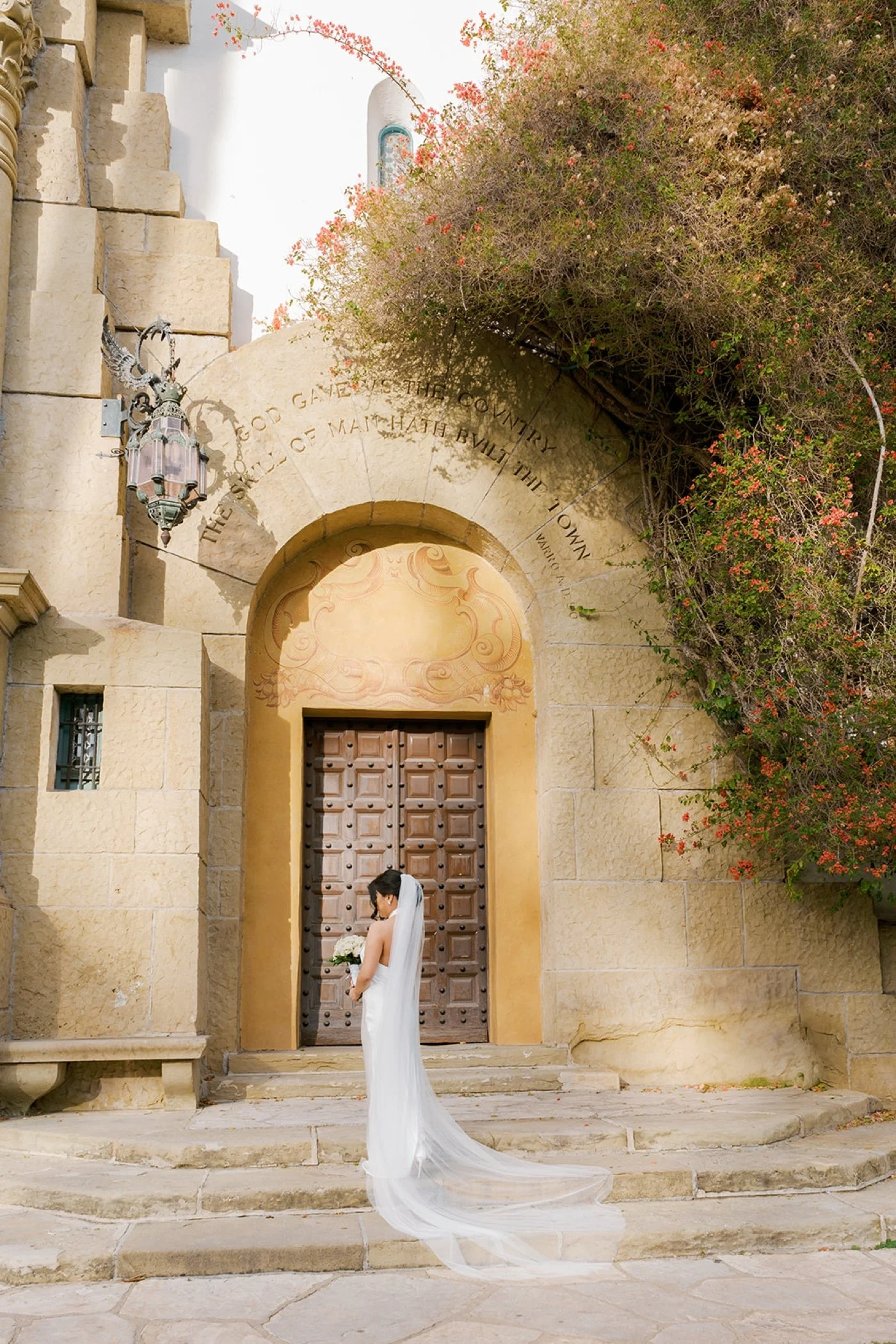 a portrait of a bride getting married at the santa barbara courthouse
