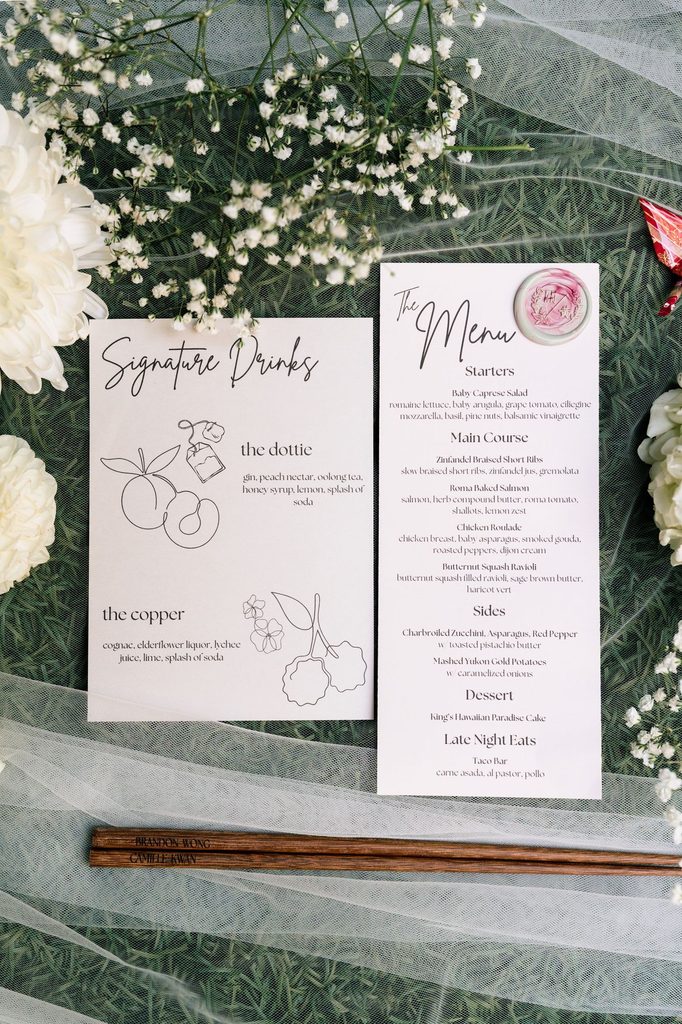 Signature drinks and menu cards with chopsticks and baby's breath