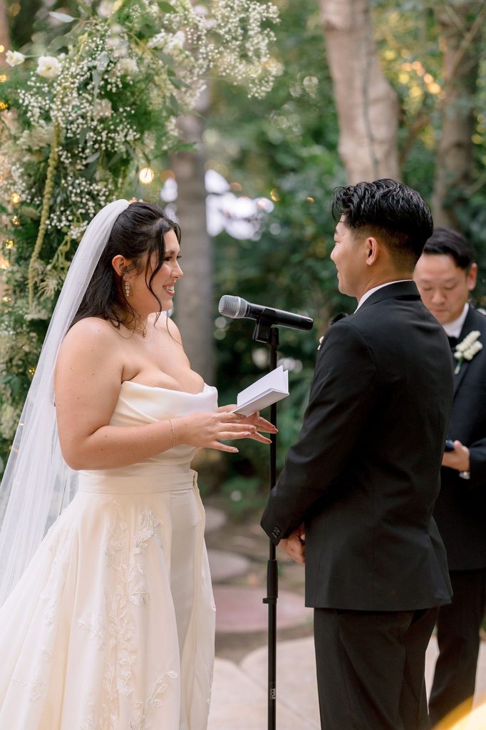 Bride reading her vows at the microphone