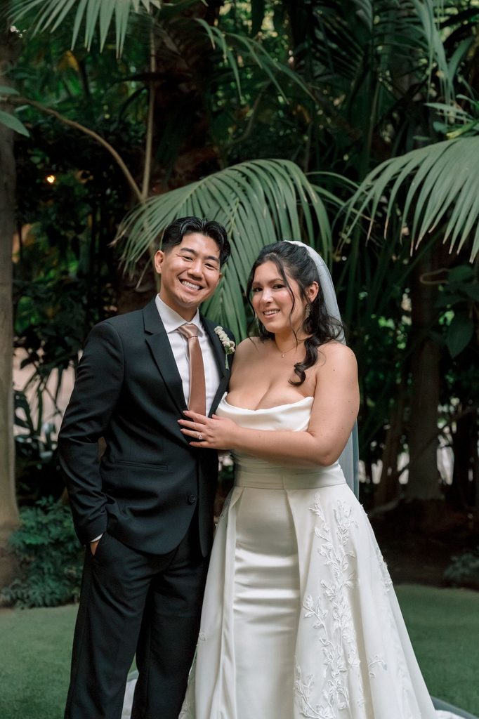Portrait of the newlyweds on the lawn at Hartley Botanica