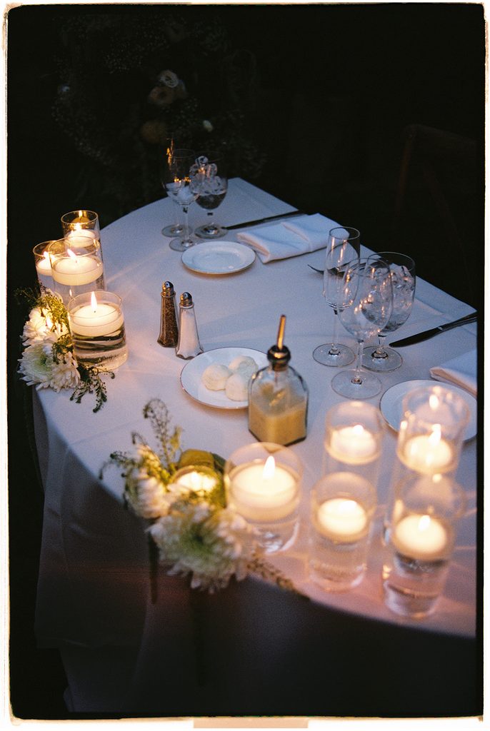 Sweetheart table at night by candlelight, on film